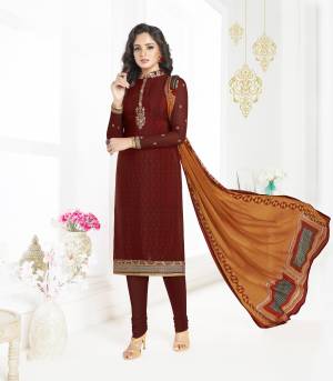 Grab This Royal And Elegant looking Dress Material In Maroon Color Paired With Rust Colored Dupatta. Its Top And Bottom Are Fabricated On Crepe Paired With Chiffon Dupatta. Buy This Suit Now.