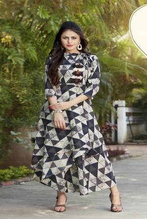 Elegant Looking Designer Kurti Is Here For Your Festive Or Semi-Casual Wear, Grab This Kurti In Grey And White Color Fabricated On Cotton Beautified With Prints All Over It. Buy Now.
