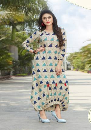 Simple And Elegant Looking Designer Readymade Kurti Is Here In Cream Color Fabricated On Rayon Beautified With Geometrical Prints All Over. Buy This Kurti Now.