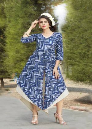 For Your Semi-Casuals, Grab This Designer Readymade Kurti In Blue Color Paired With Red Colored Scarf. This Readymade Kurti Is Fabricated On Rayon Beautified With Prints. Also It Is Available In All Regular Sizes. Buy Now.