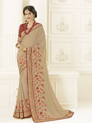 Impress everyone with your amazing Trendy look by draping this beige color silk fabrics saree. this party wear saree won't fail to impress everyone around you. this gorgeous saree featuring a beautiful mix of designs. Its attractive color and designer heavy embroidered design, Flower patch design, stone design, beautiful floral design work over the attire & contrast hemline adds to the look. Comes along with a contrast unstitched blouse.