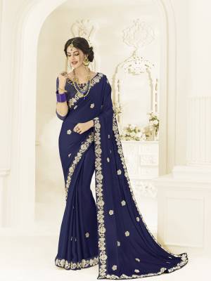 The fabulous pattern makes this Navy Blue color moss chiffon saree. Ideal for party, festive & social gatherings. this gorgeous saree featuring a beautiful mix of designs. Its attractive color and designer heavy embroidered design, Flower patch design, stone design, beautiful floral design work over the attire & contrast hemline adds to the look. Comes along with a contrast unstitched blouse.