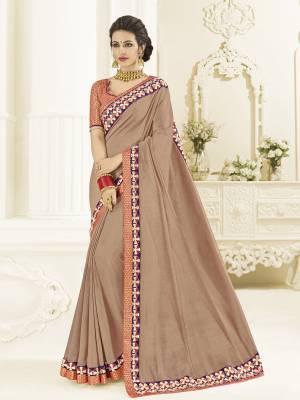 Gorgeously mesmerizing is what you will look at the next wedding gala wearing this beautiful Dusty Beige color two tone silk saree. Ideal for party, festive & social gatherings. this gorgeous saree featuring a beautiful mix of designs. Its attractive color and designer heavy embroidered design, Flower patch design, beautiful floral design work over the attire & contrast hemline adds to the look. Comes along with a contrast unstitched blouse.