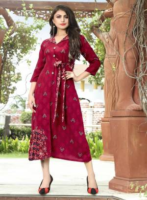 Add This Pretty Readymade Kurti In Magenta Pink Color Fabricated On Rayon Beautified With Prints. This Kurti Is Light Weight And Easy To Carry All Day Long. Buy Now.