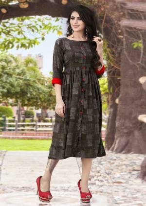 For Your College Wear, Office Wear Or Semi-Casual Wear, Grab This Designer Readymade Kurti In Dark Grey Color Fabricated On Rayon Beautified With Checks Prints all Over. Buy Now.