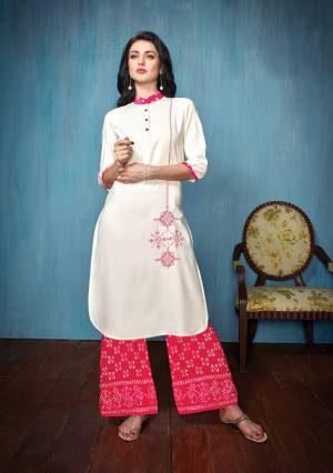 For Your Semi-Casual Wear Or Festive Wear, Grab This Readymade Kurti Set In White Colored Top Paired With Dark Pink Colored Bottom. Its Top Is Fabricated On Embroidered Rayon Paired With Printed Cotton Bottom. 
