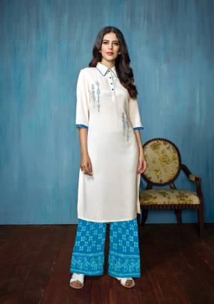 Elegant Looking Collar Pattern Readymade Kurta Set Is Here In White Colored Top Paired With Blue Colored Bottom. Its Top Is Rayon Fabricated Paired With Cotton Bottom. It Is Beautified with Thread Work And Prints Over The Bottom.