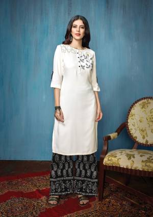 Rich and Elegant Looking Designer Readymade Kurta Set Is Here In White Colored Top Paired With black Colored Bottom. Its Top Is Rayon Based Fabric Paired With Cotton Bottom. Buy Now.