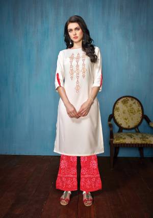 This Festive Season, Grab This pretty Kurta Set In White Colored Top Paired With Red Colored Bottom. Its Top Is Fabricated On Rayon Paired With Cotton Bottom. Both Its Fabrics Esnures Superb Comfort All Day Long.