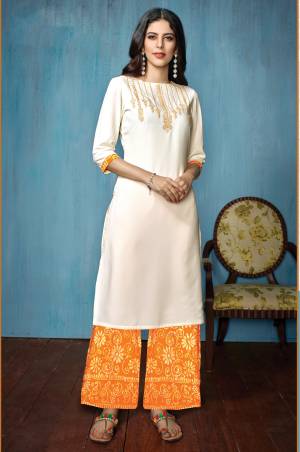 Look Beautiful And Earn Lots Of Compliments Wearing this Designer Readymade Kurta Set In White Colored Top Paired With Yellow Colored Bottom. Its Top Is Fabricated On Rayon Paired With Cotton Bottom. Buy Now.