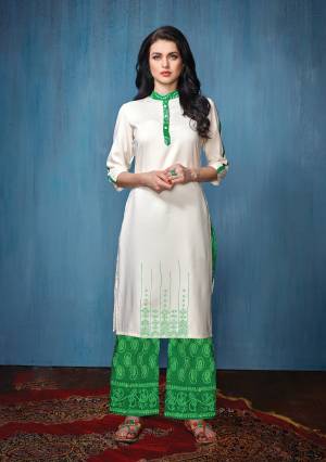 Elegant Looking Collar Pattern Readymade Kurta Set Is Here In White Colored Top Paired With Green Colored Bottom. Its Top Is Rayon Fabricated Paired With Cotton Bottom. It Is Beautified with Thread Work And Prints Over The Bottom.