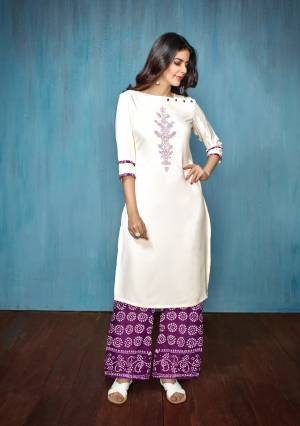 For Your Semi-Casual Wear Or Festive Wear, Grab This Readymade Kurti Set In White Colored Top Paired With Purple Colored Bottom. Its Top Is Fabricated On Embroidered Rayon Paired With Printed Cotton Bottom. 