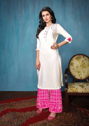 This Festive Season, Grab This pretty Kurta Set In White Colored Top Paired With Pink Colored Bottom. Its Top Is Fabricated On Rayon Paired With Cotton Bottom. Both Its Fabrics Esnures Superb Comfort All Day Long.