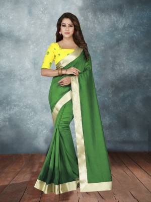 Celebrate This Festive With Beauty And Comfort Wearing This Bright And Attractive Saree In Green Color Paired With Contrasting Yellow Colored Blouse. This Saree And Blouse are Fabricated On Art Silk. It IS Easy To Drape And Carry All Day Long.