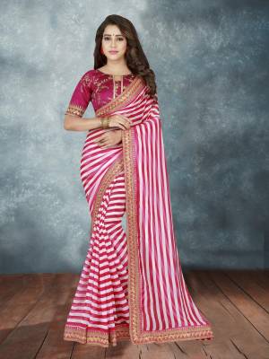 Here Is A Very Pretty Saree In Dark Pink And White color Paired With Dark Pink Colored Blouse. This Saree Is Fabricated On Georgette Beautified with Lining Prints Paired With Art Silk Fabricated Embroidered Blouse. Buy Now.