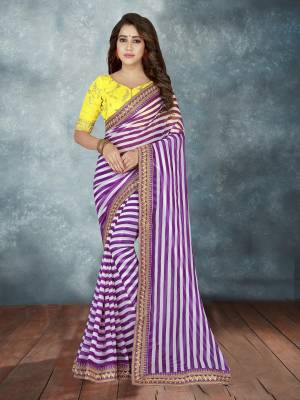 Another Pretty Saree With Lining Prints Is Here In White And Purple Color Paired With Contrasting Yellow Colored Blouse. This Saree Is Fabricated On georgette Paired With Art Silk Fabricated Blouse. It Is Beautified With Embroidery Over The Blouse And Saree Lace Border.