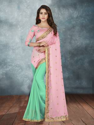 Look Very Pretty With This Soft Color Pallete, With This Designer Saree In Pink And Aqua Blue Color Paired With Pink Colored Blouse. This Saree Is Fabricated On Georgette Paired With Art Silk Fabricated Blouse. Its Lovely Colors Will Earn You Lots Of Compliments From Onlookers.