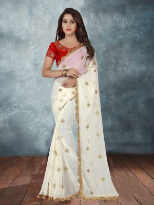 Simple Yet Elegant Looking Designer Saree Is Here In White Color Paired With Red Colored Blouse. This Saree Is Fabricated On Georgette Paired With Art Silk Fabricated Blouse. This Saree Is Beautified With Embroidered Motifs All Over The Saree.
