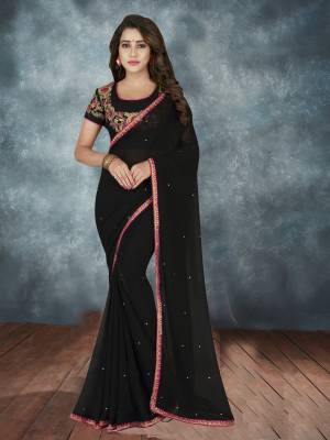 For A Bold And Beautiful Look, Grab This Designer Saree In Black Color Paired With Black Colored Blouse. This Saree IS Fabricated On Georgette Paired With Art Silk fabricated Blouse. Buy This Saree Now.