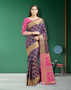 You Will Definitely Earn Lots Of Compliments Wearing This Silk Saree With A Very Pretty Color Pallete. This Saree Is In Dark Violet Color Paired With Contrasting Pink Colored Blouse. This Saree And Blouse are Fabricated On Art Silk Beautified With Small Weave All Over.