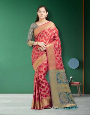 Adorn the Pretty Angelic Look In This Silk Based Saree In Red Color Paired With Contrasting Light Blue Colored Blouse. This Saree And Blouse are Fabricated On Art Silk Beautified With Weave All Over. 