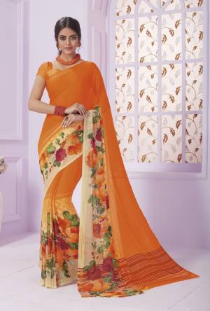 Orange Color Induces Perfect Summery Appeal To Any Outfit, So Grab This Saree In Orange Color Paired With Orange Colored Blouse. This Saree Is Georgette Paired With Crepe Blouse Beautified With Floral Prints.