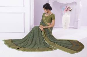 Add This Beautiful Olive Green Colored Saree Fabricated On Georgette Paired With Crepe Fabricated Blouse. It Is Beautified with Printed And Lace Border. Also It Is Light Weight And easy To Carry All Day Long.