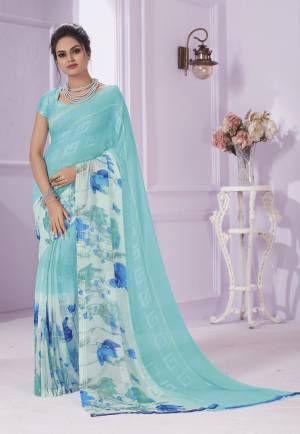 A Very Pretty Shade In Blue Is Here With This Saree In Aqua Blue Color Paired With Aqua Blue Colored Blouse. This Saree Is Georgette Based Paired With Crepe Fabricated Blouse. Both Its Fabrics Ensures Superb Comfort All Day Long.