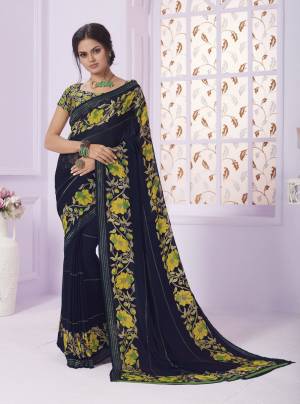Go Floral With this Lovely Saree In Navy Blue Color Paired With Multi Colored Blouse. This Saree Has Attractive Floral Prints Over The Saree And Blouse. Buy This Georgette Based Saree Now.