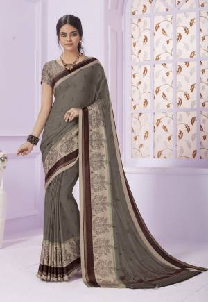 Flaunt Your Rich and Elegant Taste Wearing This Saree In Grey Color Paired With Grey Colored Blouse. This Saree Is Fabricated On Georgette Paired With Creoe Fabricated Blouse. It Has Pretty Small Prints Over The Saree.