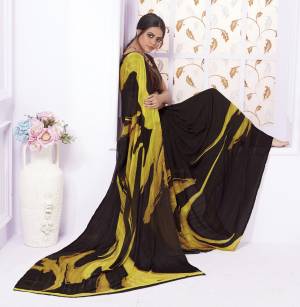 Enhance Your Beauty And Personality Wearing This Saree In Dark Brown Color Paired With Dark Brown Colored Blouse. This Saree Is Fabricated On Georgette Paired With Crepe Fabricated Blouse, It Is Beautified with Bold Multi Colored Floral Prints.