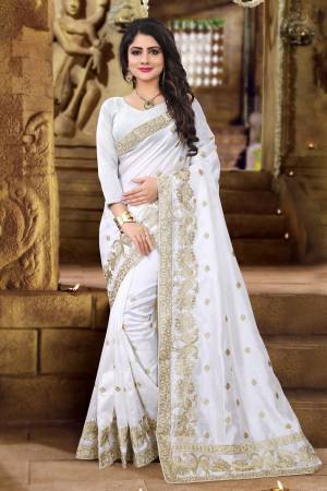 Simple And Elegant Looking Designer Silk Saree Is Here In White Color Paired with White Colored Blouse. This Saree And Blouse Are Fabricated On Art Silk Beautified With Jari Embroidery. Biuy Now.
