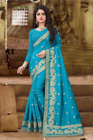 Beautiful Shade In Green Is Here With This Designer Silk Saree In Turquoise Blue color Paired with Turquoise Blue Colored Blouse, This Saree And Blouse Are Fabricated On Art Silk Beautified with Jari Embroidery. Buy This Silk Designer Saree Now.