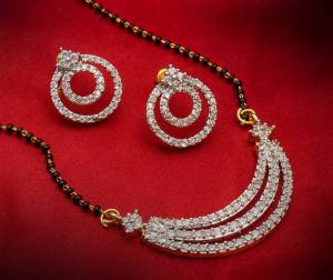 Here Is A Beautiful Designer Piece With This Lovely Mangalsutra To Pair Up With Your Heavy Dresses. This Mangalsutra Set Comes With A Very Pretty Pair Of Earrings. Buy Now.