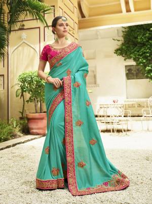 Look Pretty Wearing this Designer Saree In Blue Color Paired With Contrasting Dark Pink Colored Blouse. This Silk Based Saree Has Attractive Color Combination With Embroidery. Buy Now.