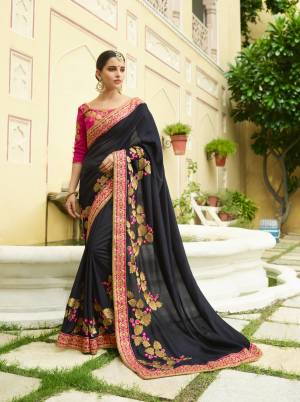 For A Bold And Beautiful Look, Grab This Designer Saree In Black Color Paired With Dark Pink Colored Blouse. This Saree And Blouse are Silk Based Fabric Beautified With Heavy Embroidery Making The Saree Attractive.