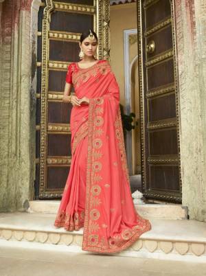 Earn Lots Of Compliments Wearing This Designer Saree In Dark Peach Color Paired With Red colored Blouse. This Saree IS Soft Silk Fabricated Paired with Art Silk Blouse. It Is Beautified with Heavy Embroidery, So This Saree Is Suitable For All Occasion Wear.