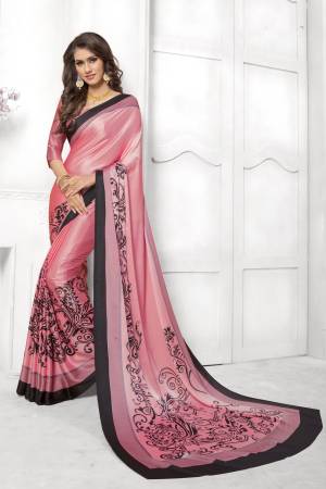 Look Attractive In This Satin Based Saree In Pink Color Paired With Pink Colored Blouse, This Saree And Blouse are Fabricated On Satin Silk Beautified With Black Colored Prints. This Saree Is Light Weight And Soft Towrds Skin And Easy To carry All Day Long. Buy Now.