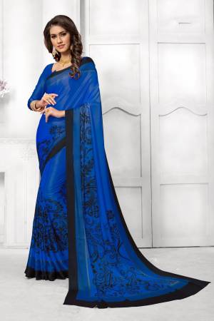 Look Attractive In This Satin Based Saree In Royal Blue Color Paired With Royal Blue Colored Blouse, This Saree And Blouse are Fabricated On Satin Silk Beautified With Black Colored Prints. This Saree Is Light Weight And Soft Towrds Skin And Easy To carry All Day Long. Buy Now.