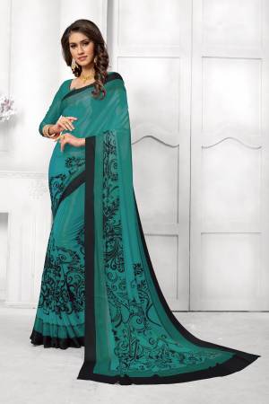 Look Attractive In This Satin Based Saree In Teal Green Color Paired With Teal Green Colored Blouse, This Saree And Blouse are Fabricated On Satin Silk Beautified With Black Colored Prints. This Saree Is Light Weight And Soft Towrds Skin And Easy To carry All Day Long. Buy Now.