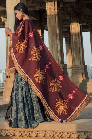 For A Royal Look,  Grab This Designer Dupatta In Maroon Color Fabricated On Khadi Cotton Beautified With Contrasting Thread work And Pom Pom Lace. This Can Be Paired With Grey, Yellow, White Or Maroon Colored Suit Or Chaniya Choli.