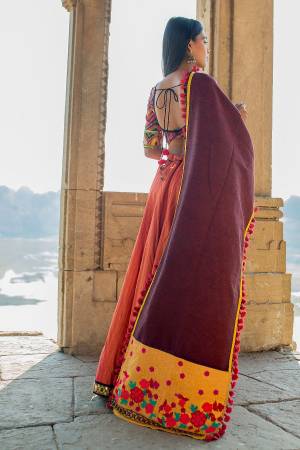 Add This Lovely Dupatta To Your Wardrobe In Wine Color Paired With Same Or Contrasting Colored Attire. This Dupatta Is Fabricated On khadi Cotton Beautified With Thread Work And Pom Pom Lace.