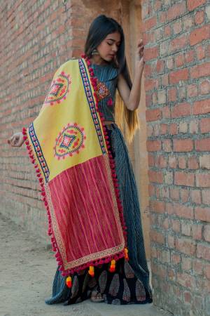 For A Proper Traditional Look, Grab This Beautiful Designer Dupatta In Yellow And Pink Color Fabricated On Khadi Cotton Beautified With Thread Work And Pom Pom Laces. Yhis Dupatta Can Be Paired With Any Contrasting Colored Attire. 