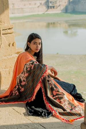 Grab This Beautiful Designer Dupatta In Orange And Multi Color Fabricated On Khadi Cotton Beautified with Thread Work And Pom Pom Laces. This Pretty Dupatta Can Be Paired With Any Contrasting Suit Or Can Be Used In Navratri With Your Chaniya Choli.