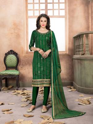 Enhance Your Personality Wearing This Designer Straight Cut Suit In Dark Green Color. Its Top Is Fabricated On Art Silk Paired With Santoon Bottom And Net Dupatta. It Is Beautified With Jari Embroidery And Mirror Work. Buy Now.