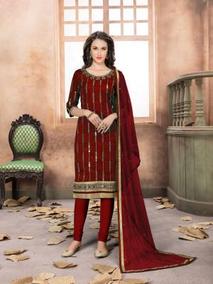 Enhance Your Personality Wearing This Designer Straight Cut Suit In Maroon Color. Its Top Is Fabricated On Art Silk Paired With Santoon Bottom And Net Dupatta. It Is Beautified With Jari Embroidery And Mirror Work. Buy Now.