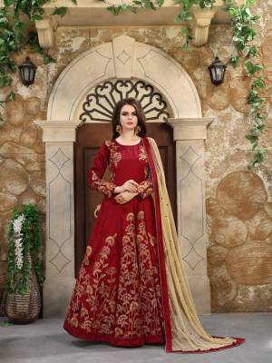 Grab This Designer Floor Length Suit In Maroon Colored Top Paired With Maroon Colored Bottom And Beige Colored Dupatta. Its Top Is Fabricated On Art Silk Paired With Santoon Bottom And Net Dupatta. It Is Beautiufied With Heavy Jari Embroidery And Sequence Work.