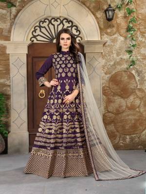 You Will Earn Lots Of Compliments Wearing This Designer Floor Length Suit In Purple Colored Top And Bottom Paired With Off-White Colored Dupatta. Its Top Is Fabricated On Art Silk Paired With Santoon Bottom And Net Dupatta. Buy This Suit Now.