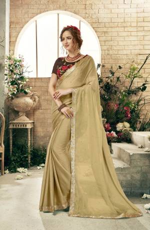 Flaunt Your Rich And Elegant Taste Wearing This Designer Saree In Beige Color Paired With Brown Colored Blouse. This Saree Has Chiffon Based Fabric Paired With Art Silk Blouse. It Is Light Weight And Ensures Superb Comfort All Day Long.