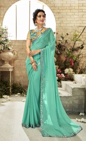 Look Pretty In This Designer Aqua Blue Colored Saree Paired With Beige Colored Blouse. This Saree Is Fabricated On Chiffon Paired With Art Silk Fabricated Blouse. It Is Light Weight And Easy To Carry All Day Long.